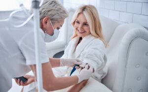Patient receiving care from a medical professional in a calm setting representing what to expect during ketamine therapy at Elevate Mind and Mood